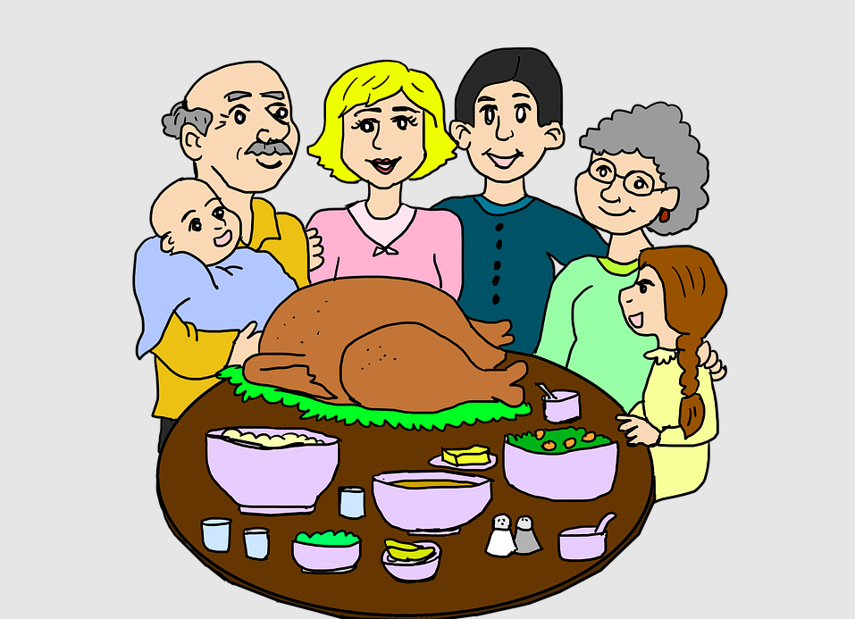 Family around a thanksgiving dinner with the main course a turkey