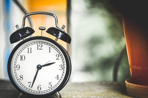 An analog clock readsa the time 2:34